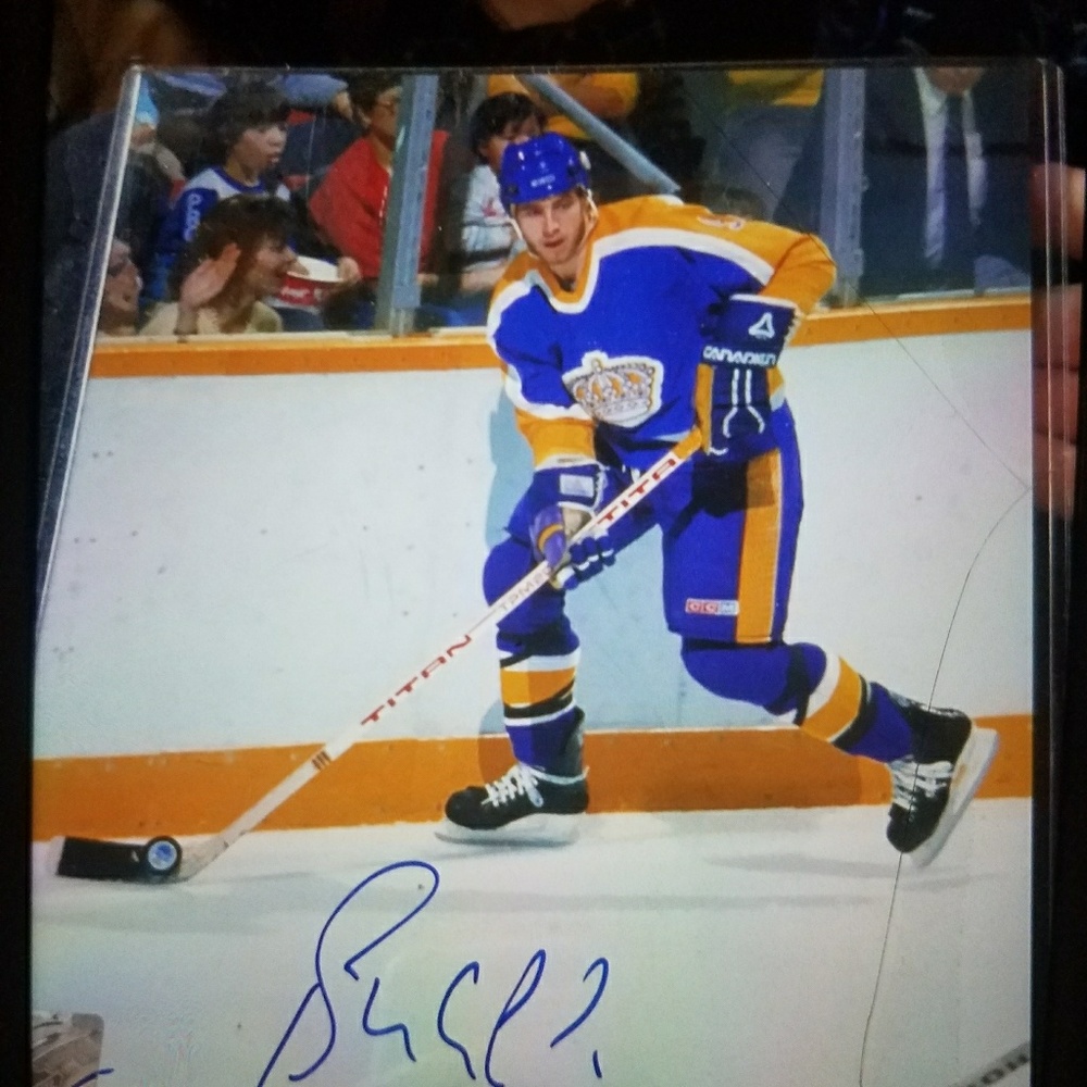 Four signed hockey photos